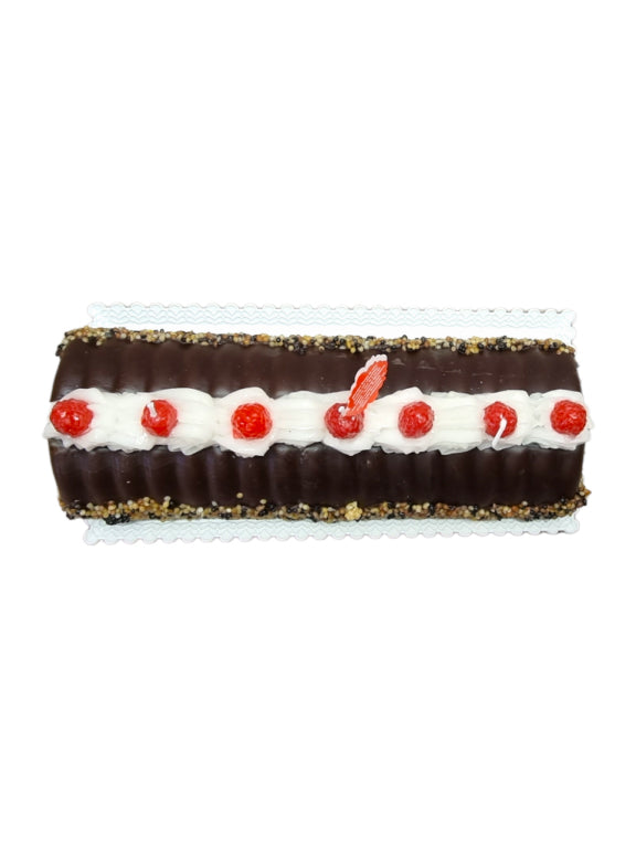 Wax candle chocolate cake with blackberries