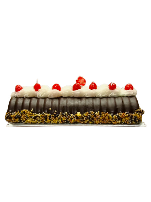 Wax candle chocolate cake with blackberries